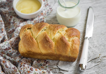 homemade sweet butter bread, brioche, on a light wooden background