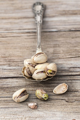 Pistachios in a vintage spoon