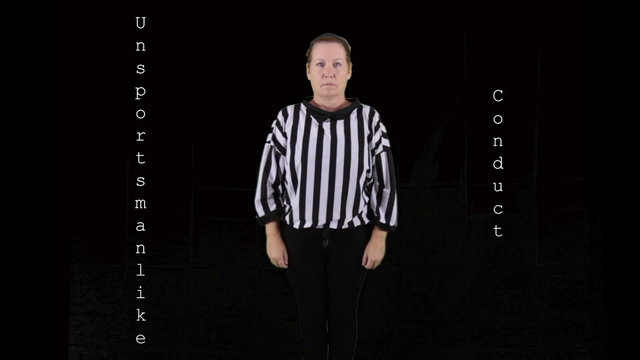 Woman dressed as a football referee signaling Unsportsmanlike Conduct.