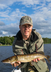Man with pike trophy