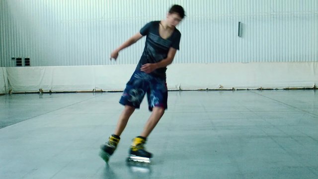 Boy roller freestyle slalom