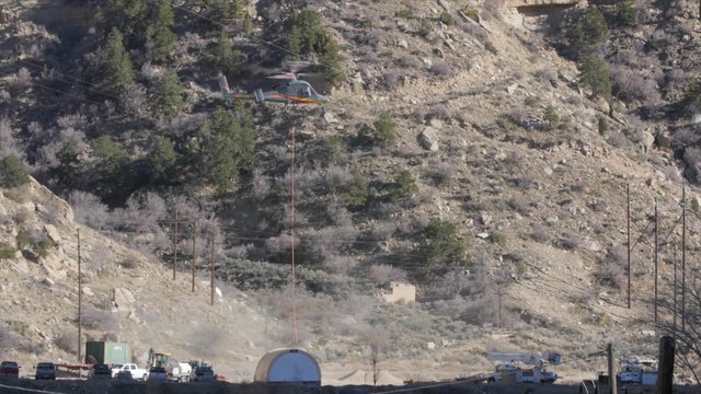 A supply Helicopter taking off in the mountains