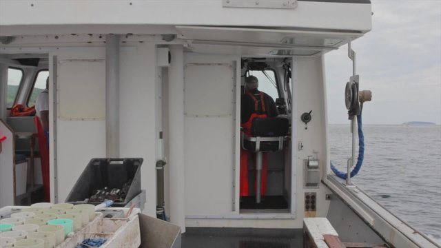 captain and his fishing boat