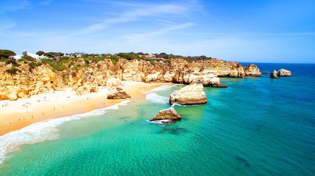 Aerial from natural rocks at Praia Tres Irmaos near Alvor in Por