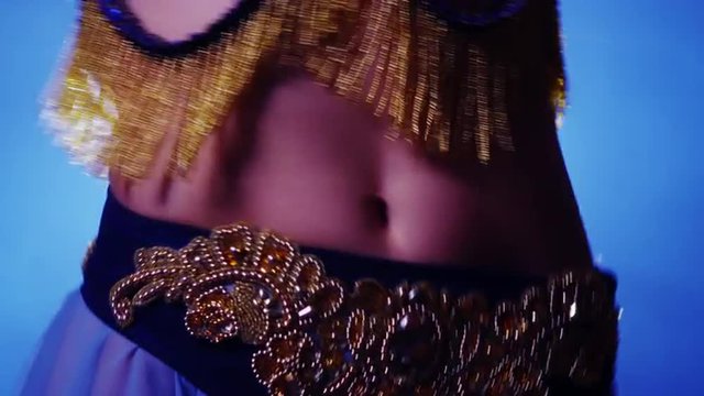 Female belly dancer shaking hips