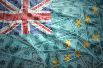 colorful waving tuvalu flag on a american dollar money background