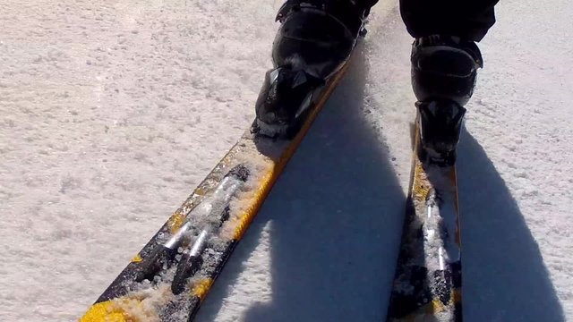 close up of skis going downhill