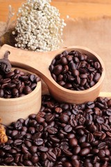 Roasted coffee beans on sack brown background.