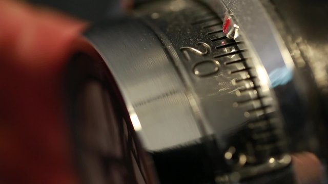 hand opening a combination lock on vault