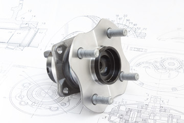 hub with bearing and ABS sensor on the background of drawings and plans