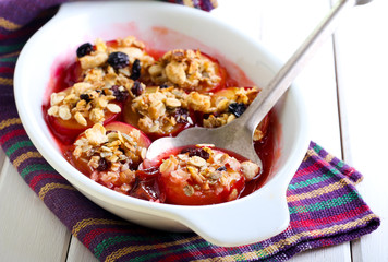 Baked plums with muesli crumble topping