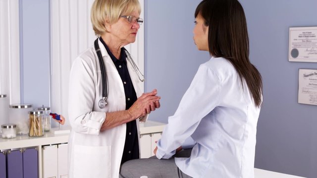 Senior doctor consulting patient on how to live healthier