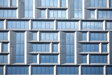 Wall of modern office building of glass and metal in techno style as background