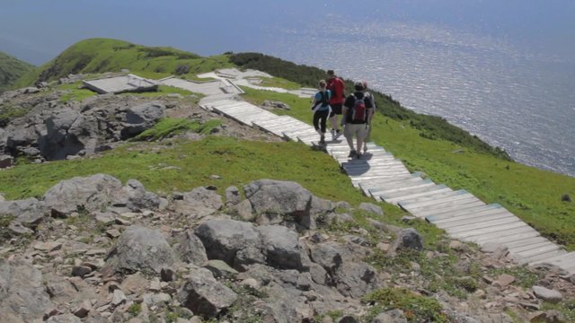 hikers along beautiful skyline trail in cape breton nova scotia