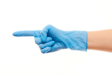 Female doctor's hand in blue surgical glove pointing on something