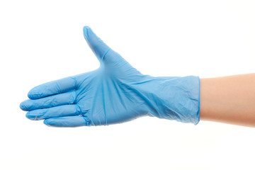 Female doctor's hand in blue surgical glove giving for handshake