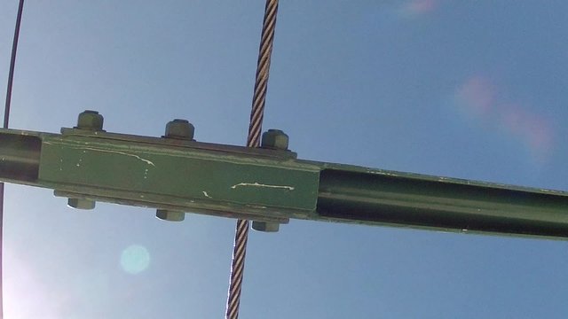 shot of chair lift going over pole