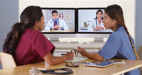 Group of diverse medical doctors video conferencing