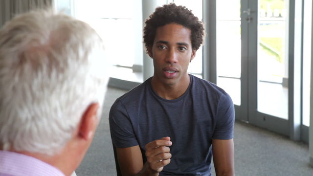 Young Man Having Counselling Session