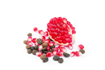 red sliced pomegranate with coffee and pomegranate grains