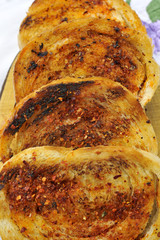 slices of garlic bread with cayenne pepper