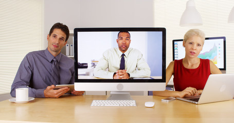 Business team talking and listening to camera