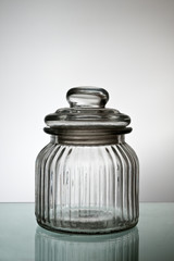 Closed empty glass jar.