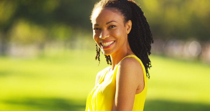 Black Woman Smiling In A Field