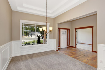 simple empty room with lots of space and carpet.