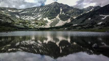 Musala peak reflected in one of the lakes of Rila mt national park Bulgaria