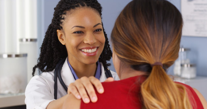 Close up of African American physician having conversation with patient