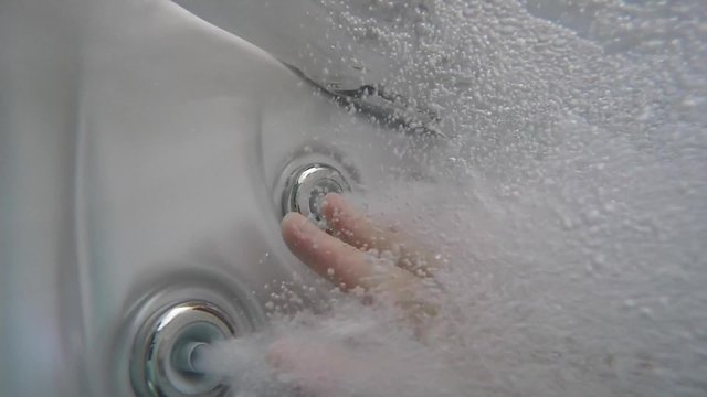 hot tob bubbles and hand in exreme slow motion