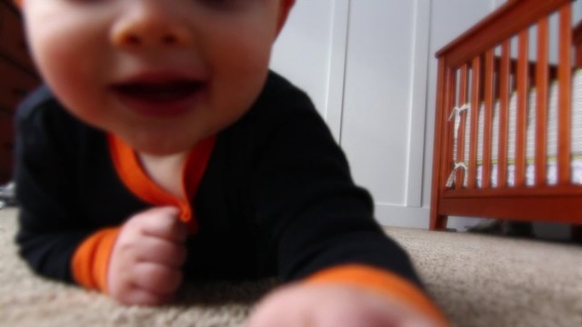 baby crawls across the floor