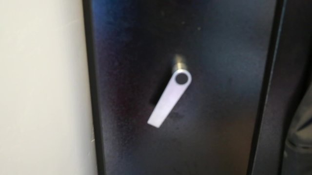 a man closes a gun safe