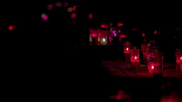 Red Candles on graveyards