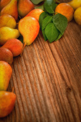 Ripe pear on a wooden background