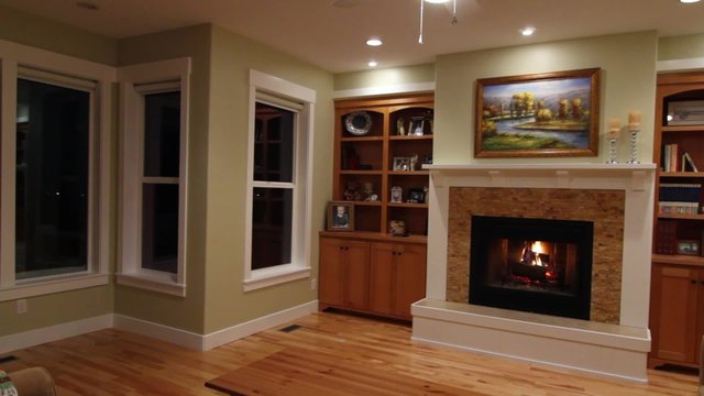 roaring fireplace in a sitting room jib shot