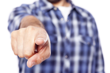 Casual man pointing the finger at you, isolated on white backgro
