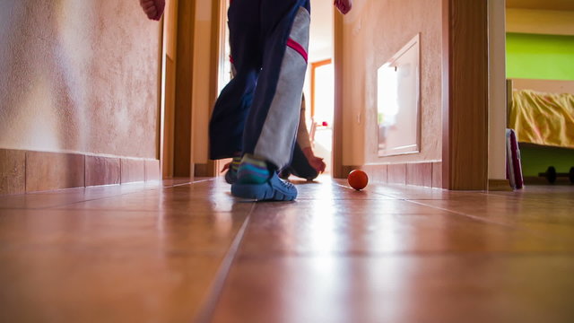 Soccer Playing In Home Hallway In Slow Motion