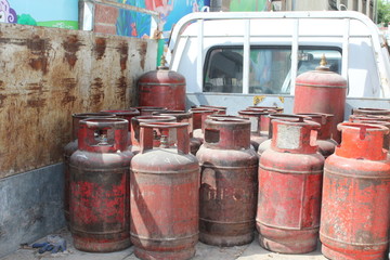 Fototapeta premium Old red gas cylinders. High pressure propane or LPG gas cylinders.