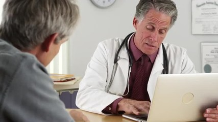 Doctor talking with senior patient