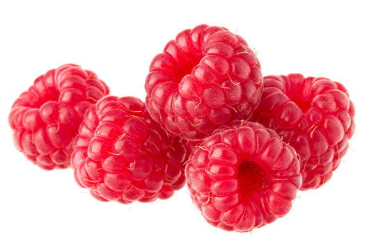 ripe raspberries isolated on white background close up