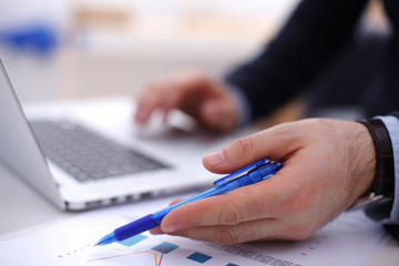 Businessman using his credit card for an online transaction