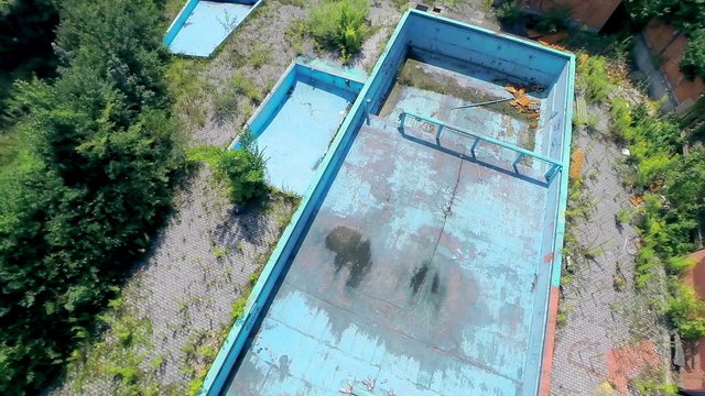 High aerial shot of abandoned pool