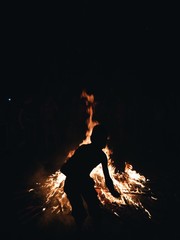 boy silhouette in bonfire