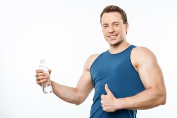 Cheerful young man is approving healthy lifestyle