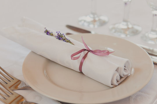 Fancy violet table set for a wedding dinner