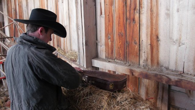 Cowboy finds a fiddle in his old barn