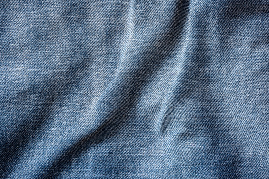 Blue jeans torn denim texture background
