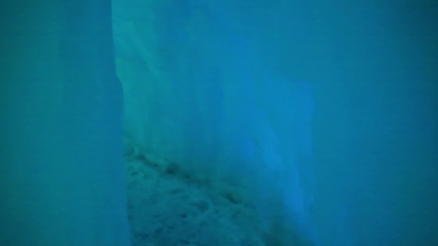 people walking around an ice castle in the winter